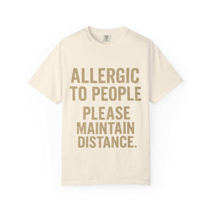 Cream t-shirt with "Allergic to People Please Maintain Distance" funny text print, casual relaxed fit, Comfort Colors brand