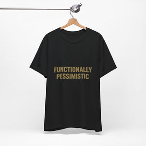 The "Functionally Pessimistic" T-Shirt by Old Man Snark (Printify) hangs on a wooden hanger, featuring bold beige lettering on black Airlume cotton, set against a plain white background.