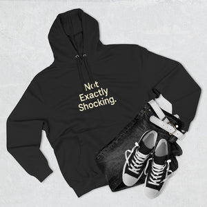 Old Man Snark black cotton-blend fleece hoodie with "Not Exactly Shocking." graphic in cream text on chest. Paired with dark wash jeans and white belt.