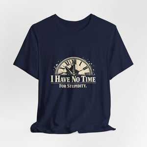 The "I Have No Time For Stupidity" T-Shirt by Printify (Old Man Snark) is a navy blue cotton tee featuring a cracked vintage clock and bold white and beige text for a distressed, classic look.