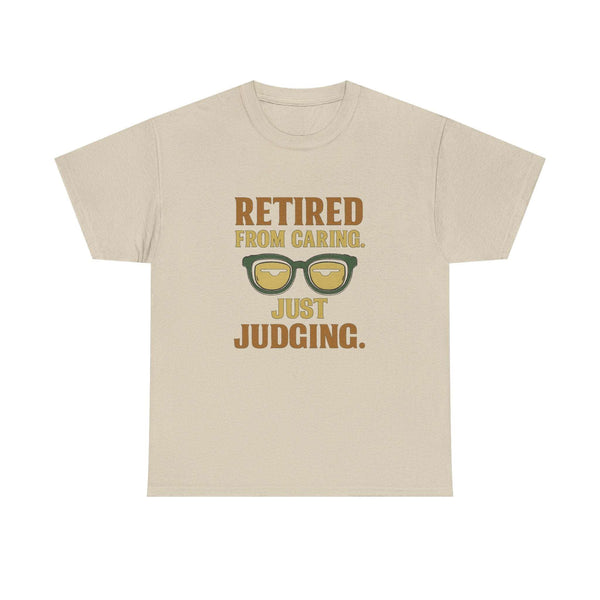 Beige Judgement Day Unisex Tee with "Retired from caring, just judging" text and glasses graphic, 100% cotton, classic fit, casual style