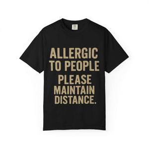 Black T-shirt with "Allergic to People Please Maintain Distance" funny text print, relaxed fit, soft garment-dyed cotton.