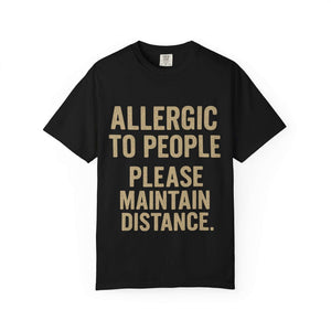 Black T-shirt with "Allergic to People Please Maintain Distance" funny text print, relaxed fit, soft garment-dyed cotton.