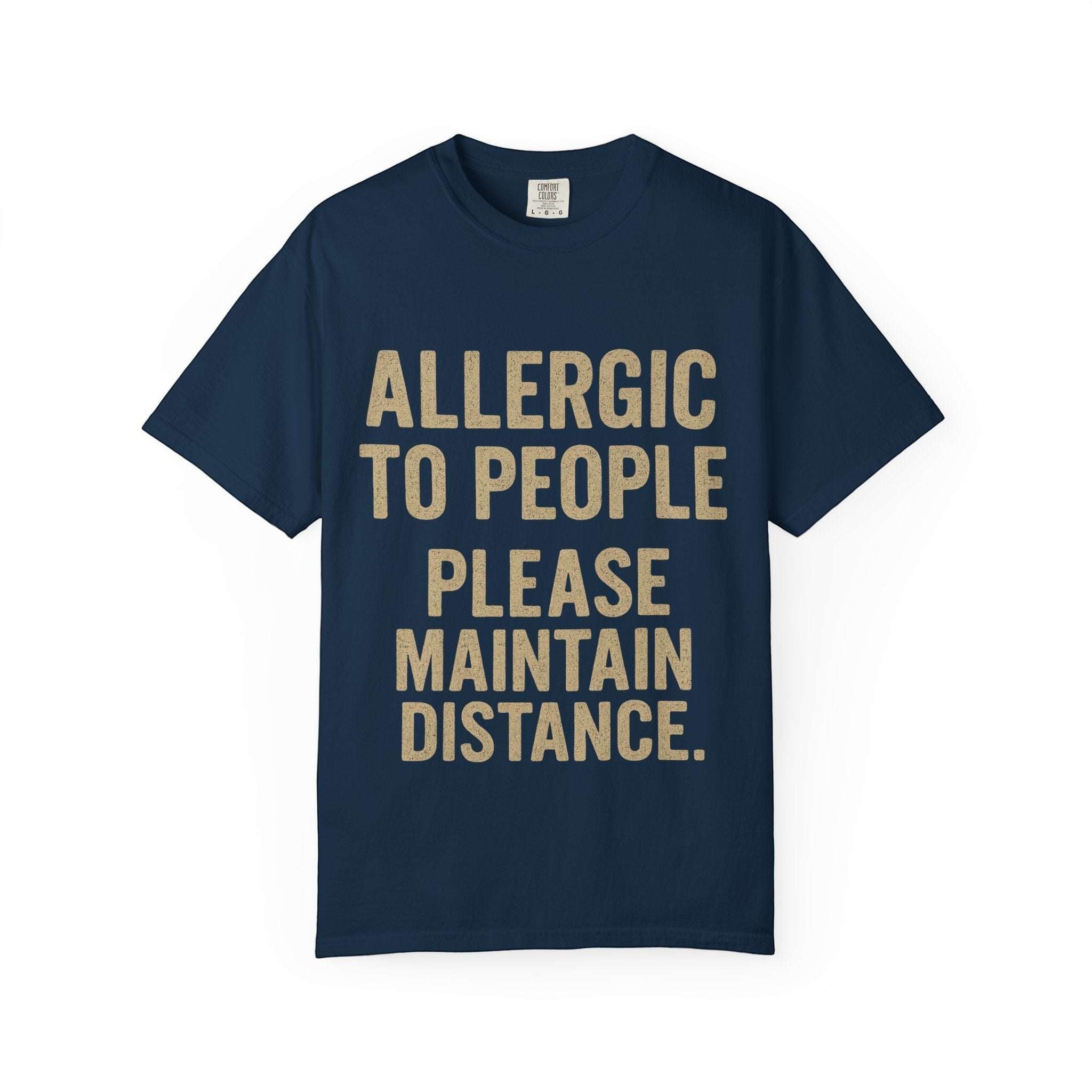 Navy blue t-shirt with bold text "Allergic to people please maintain distance" printed on the front, casual and comfortable cotton tee.
