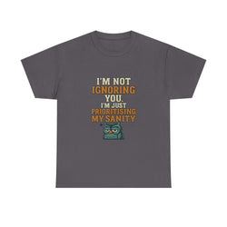 Unisex gray cotton tee with humorous "I'm Not Ignoring You, I'm Just Prioritising My Sanity" text and grumpy cartoon owl design