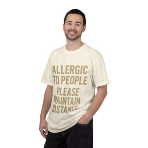 Man wearing cream-colored Allergic to People Please Maintain Distance T-shirt with bold text, casual fit