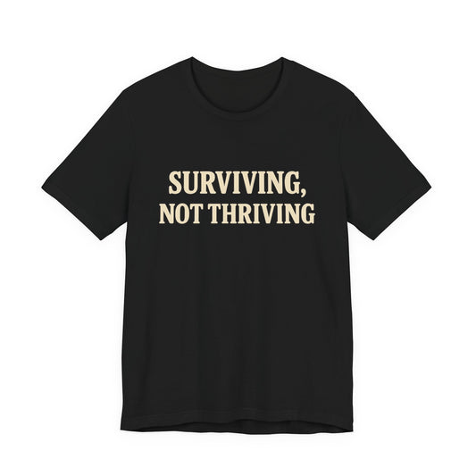 Surviving, Not Thriving – Dry Humour Cost of Living T-Shirt
