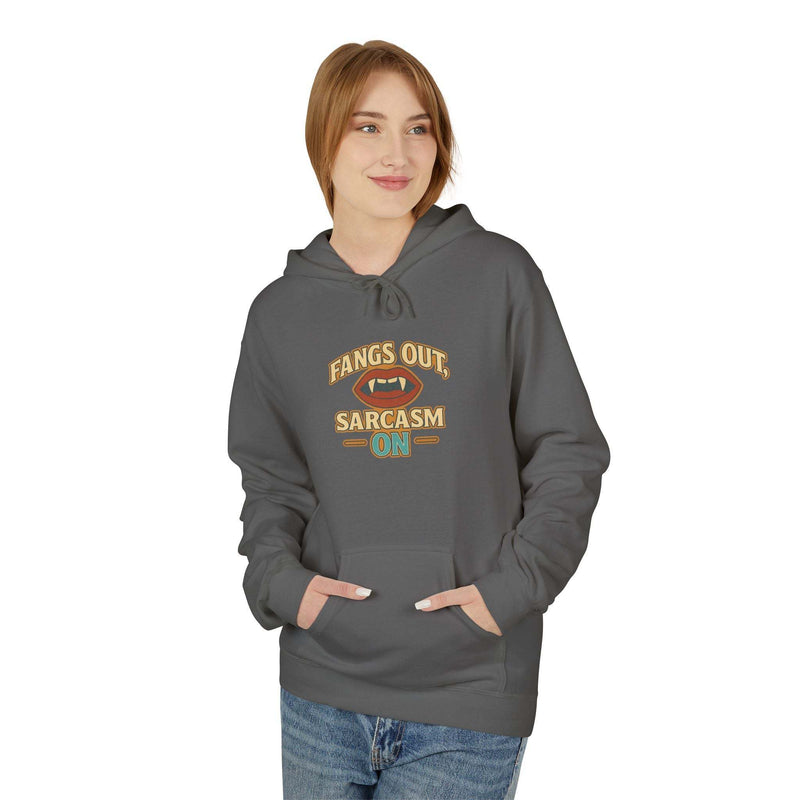 Woman wearing a gray Fangs Out Sarcasm Hoodie with front pouch pocket and playful graphic design
