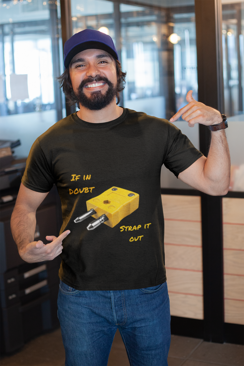 Man wearing a black funny inspirational t-shirt with a plug graphic and text "If in doubt, strap it out" indoors in casual setting
