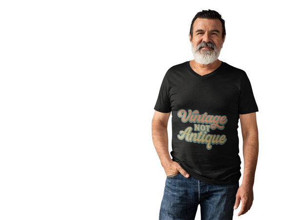 Man wearing black Vintage Vibes Unisex heavy cotton tee with "Vintage Not Antique" retro design