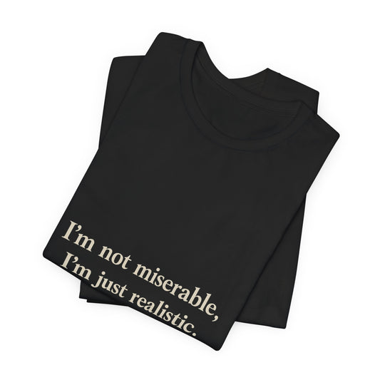 T-Shirt — "I’m Not Miserable, I’m Just Realistic" Graphic Tee