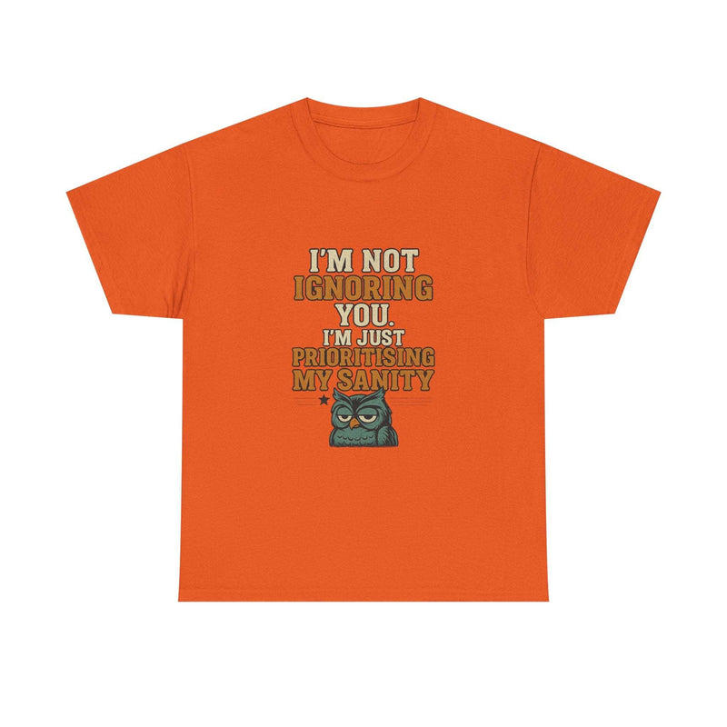 Unisex orange cotton tee with funny quote "I'm not ignoring you. I'm just prioritising my sanity" and grumpy owl graphic