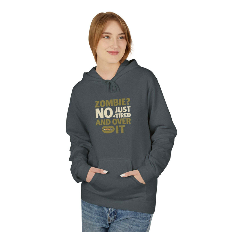 Woman wearing dark gray zombie humor fleece hoodie with humorous text print and front pouch pocket