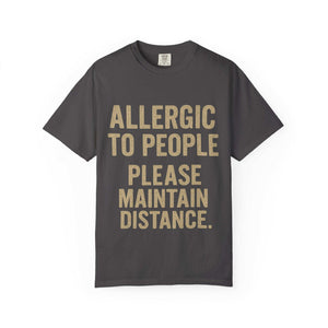 Dark gray T-shirt with "Allergic to People Please Maintain Distance" funny text print, relaxed fit cotton tee.