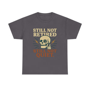 Vintage Skull Unisex Tee with "Still Not Retired Still Not Quiet" slogan and retro skull design on dark gray shirt