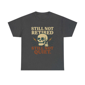 Vintage Skull Unisex Tee with retro skull design and slogan Still Not Retired Still Not Quiet on dark gray fabric