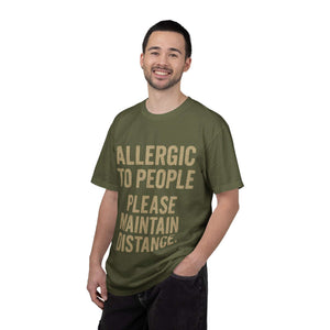 Man wearing olive green "Allergic to People Please Maintain Distance" funny text t-shirt
