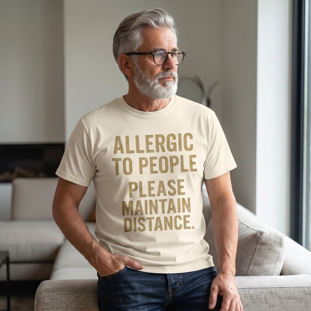 Old Man Snark cream heavyweight cotton t-shirt with Allergic to People slogan worn by a man with a grey beard.