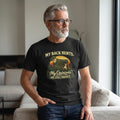 Old Man Snark black cotton t-shirt with My Back Hurts My Opinions Are Still Correct graphic worn by a mature man