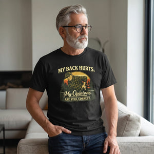 Old Man Snark black cotton t-shirt with My Back Hurts My Opinions Are Still Correct graphic worn by a mature man