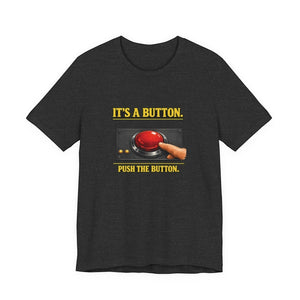The Old Man Snark "It's A Button. Push The Button." T-Shirt by Printify features a bold yellow slogan and red button graphic on dark Airlume cotton—ideal for IT professionals or tech support.