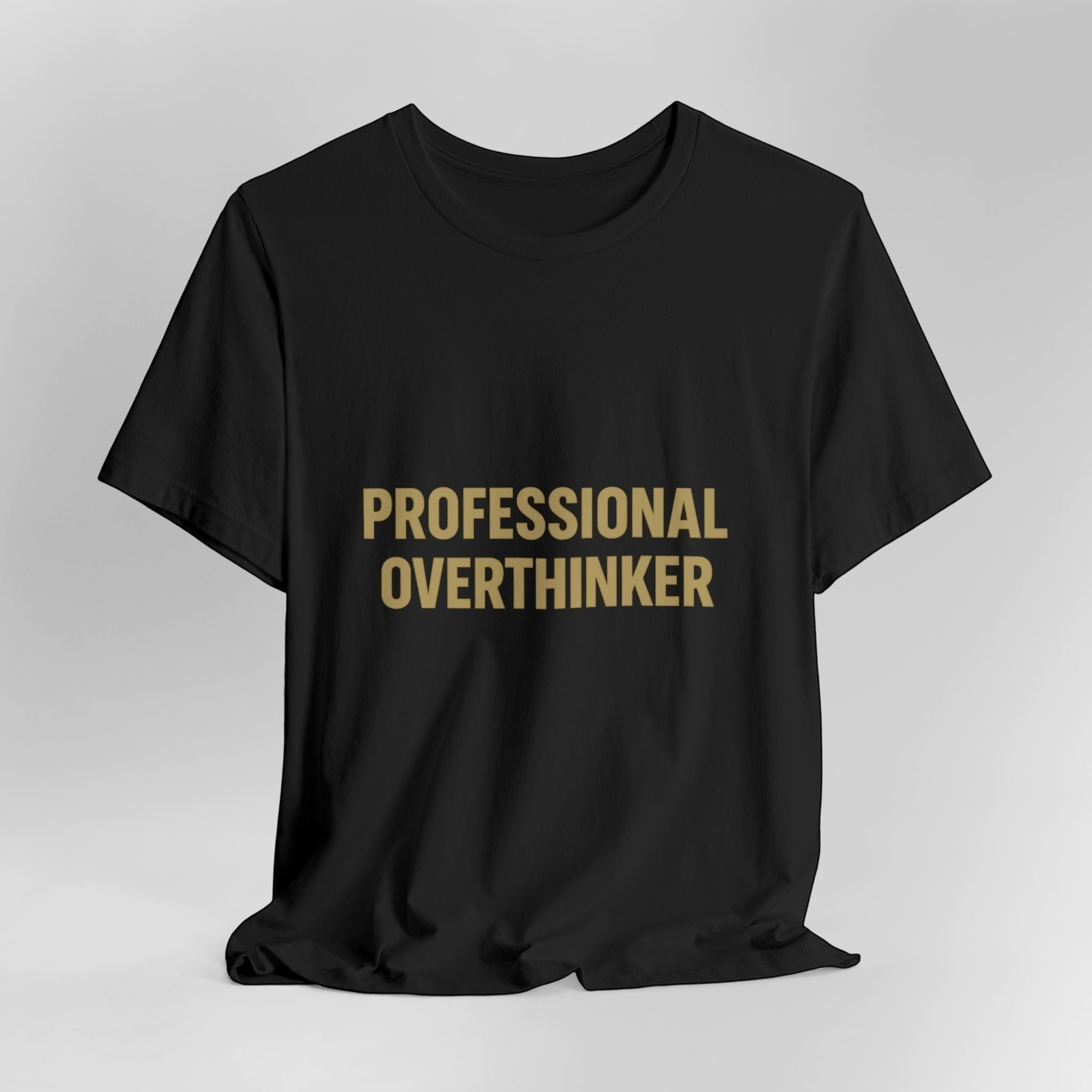 The "Professional Overthinker" T-Shirt by Printify (Old Man Snark) features bold gold lettering on black 100% Airlume cotton, shown on a plain light background.
