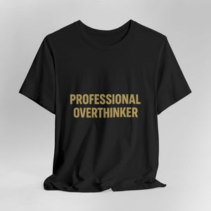 The "Professional Overthinker" T-Shirt by Printify (Old Man Snark) features bold gold lettering on black 100% Airlume cotton, shown on a plain light background.