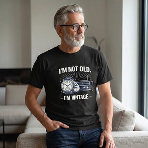 Old Man Snark black cotton t-shirt with I'm Not Old I'm Vintage slogan, worn by a man with grey hair and glasses.