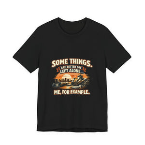 Old Man Snark black cotton t-shirt with vintage humor graphic: man relaxing with a cigar and drink, city skyline, and sunset. Text reads 'Some Things Are Better Off Left Alone... Me, For Example.'