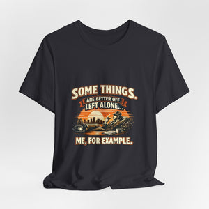 Old Man Snark black cotton t-shirt with vintage humor graphic of a man relaxing with a cigar and book, sunset city skyline.