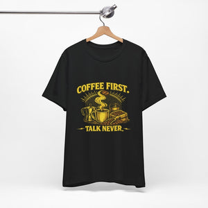Old Man Snark black cotton t-shirt with yellow "COFFEE FIRST. TALK NEVER." graphic featuring a steaming mug, moka pot, and coffee beans.