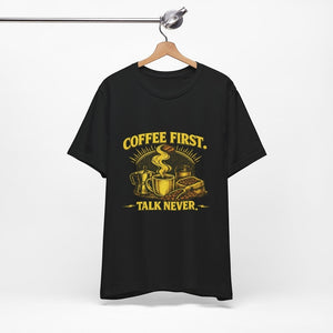 Old Man Snark black cotton t-shirt with yellow "COFFEE FIRST. TALK NEVER." graphic featuring a steaming mug, moka pot, and coffee beans.
