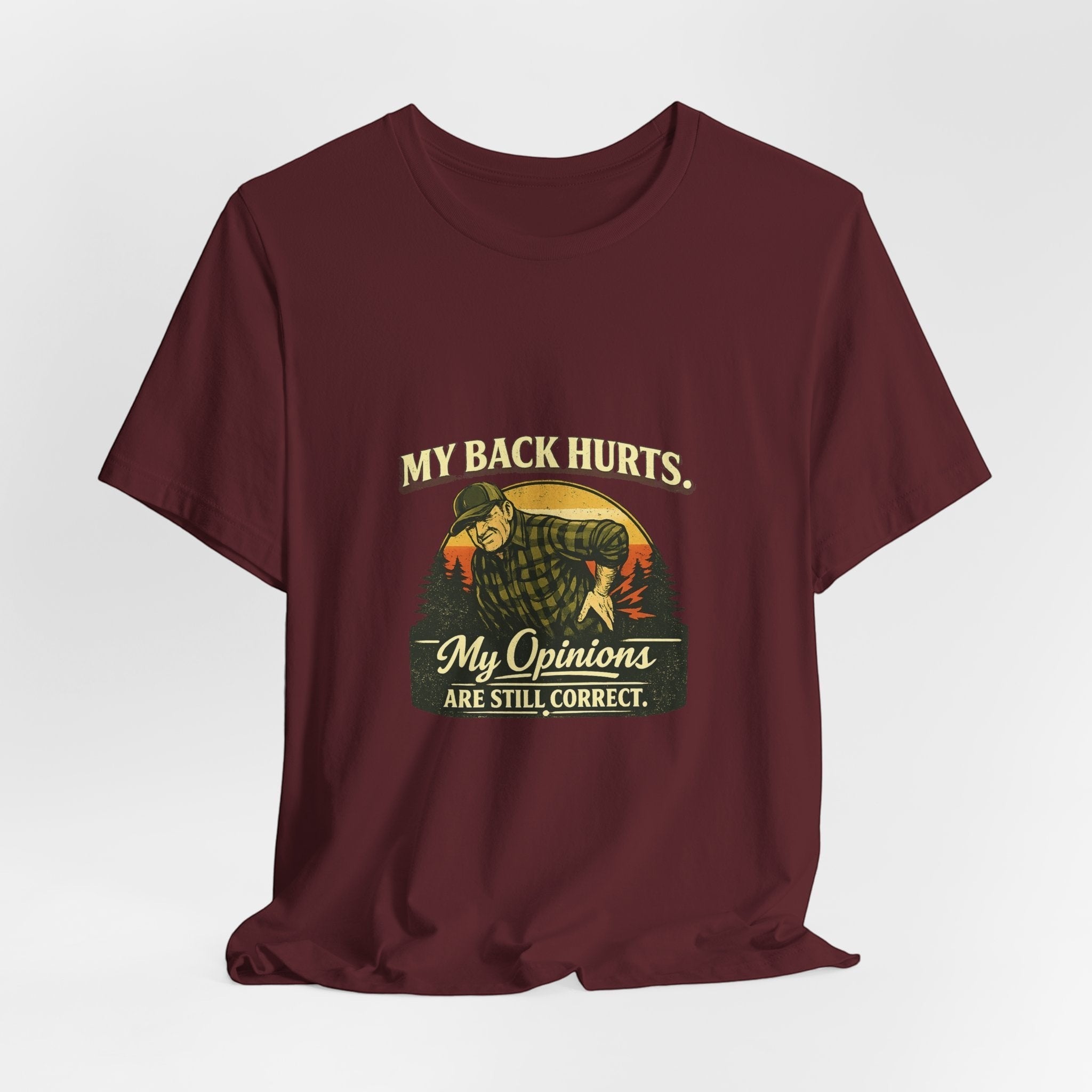 Old Man Snark maroon 100% cotton t-shirt with a vintage graphic of a man holding his back, text reads "My Back Hurts. My Opinions Are Still Correct."