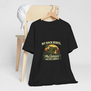 Old Man Snark black 100% cotton t-shirt with a vintage graphic of a man holding his back, text reads "My Back Hurts. My Opinions ARE STILL CORRECT."