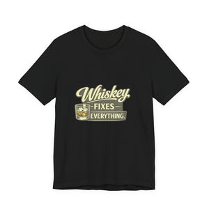 Old Man Snark black cotton t-shirt with "Whiskey Fixes Everything" graphic and a glass of whiskey.